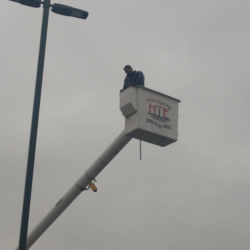 Justin, owner of HiTech Electric, in a bucket truck